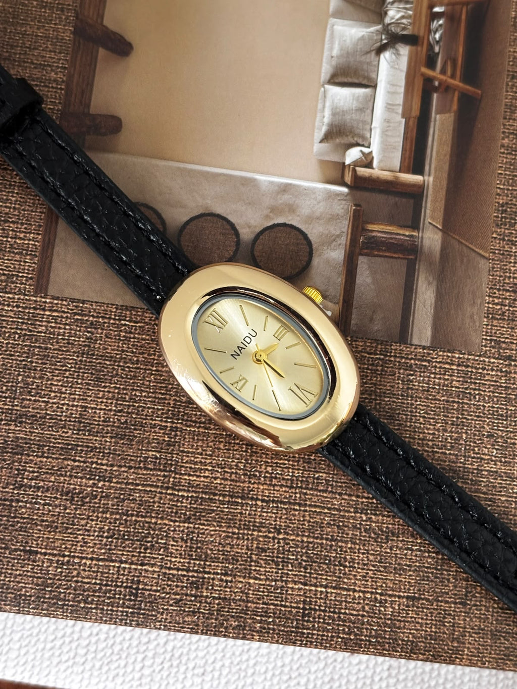 Classic Oval Gold Watch – Black Textured Strap
