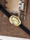 Classic Oval Gold Watch – Black Textured Strap