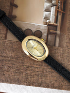 Classic Oval Gold Watch – Black Textured Strap