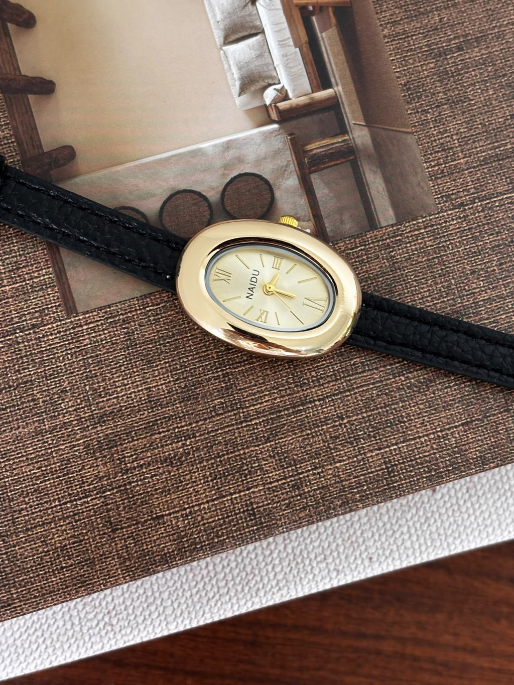Classic Oval Gold Watch – Black Textured Strap