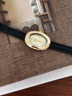 Classic Oval Gold Watch – Black Textured Strap
