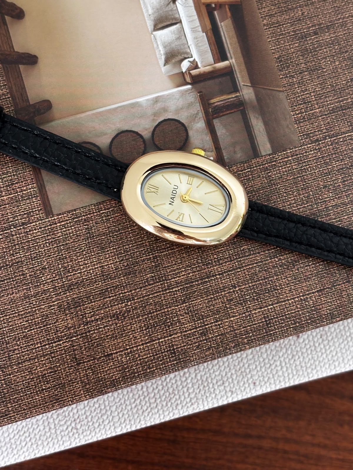 Classic Oval Gold Watch – Black Textured Strap
